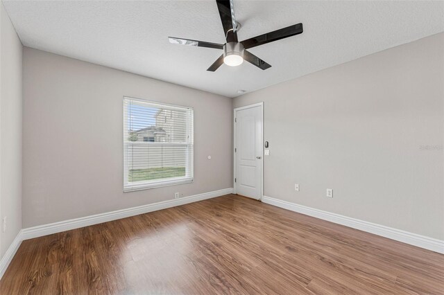 25946 Buckthorn Ave, Land O Lakes, FL 34639 - spare room featuring ceiling fan and wood finished floors