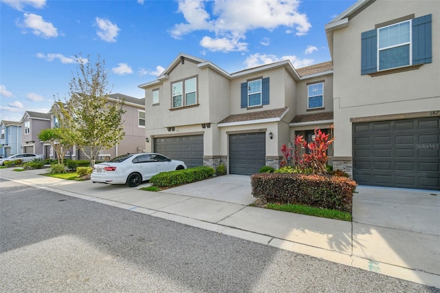 6825 Citrus Creek Ln, Tampa, FL 33625 - view of property featuring stone siding, a residential view, an attached garage, and stucco siding