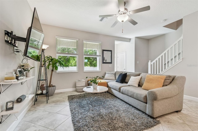 6825 Citrus Creek Ln, Tampa, FL 33625 - living area with light tile patterned floors, stairs, and ceiling fan
