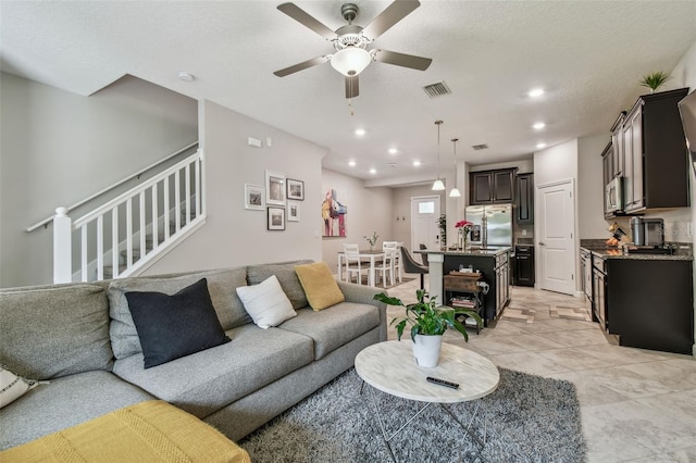 6825 Citrus Creek Ln, Tampa, FL 33625 - living area with ceiling fan, recessed lighting, and stairs