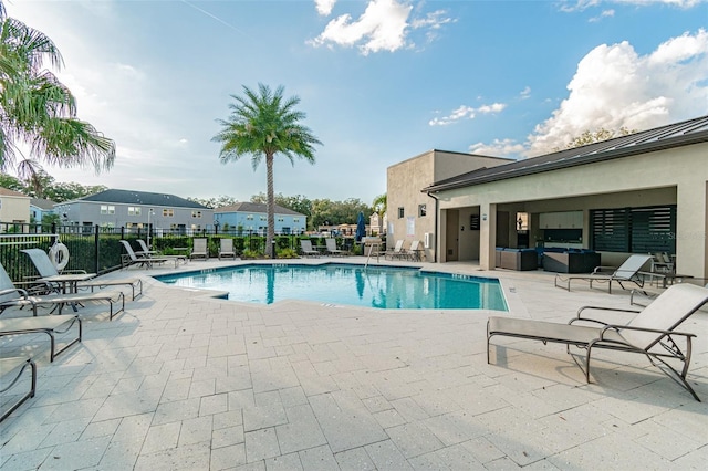 6825 Citrus Creek Ln, Tampa, FL 33625 - community pool featuring a patio area and an outdoor living space