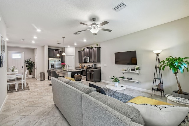 6825 Citrus Creek Ln, Tampa, FL 33625 - living area with a ceiling fan, recessed lighting, and light tile patterned flooring