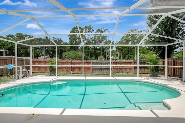 4129 Marlow Loop, Land O Lakes, FL 34639 - view of pool featuring a fenced backyard, glass enclosure, and a patio