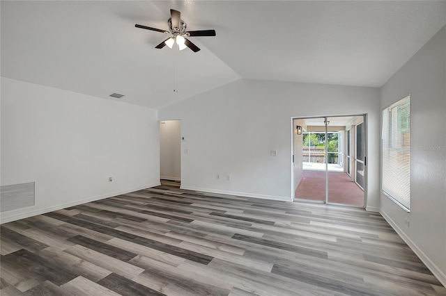 4129 Marlow Loop, Land O Lakes, FL 34639 - unfurnished room featuring ceiling fan, vaulted ceiling, and wood finished floors