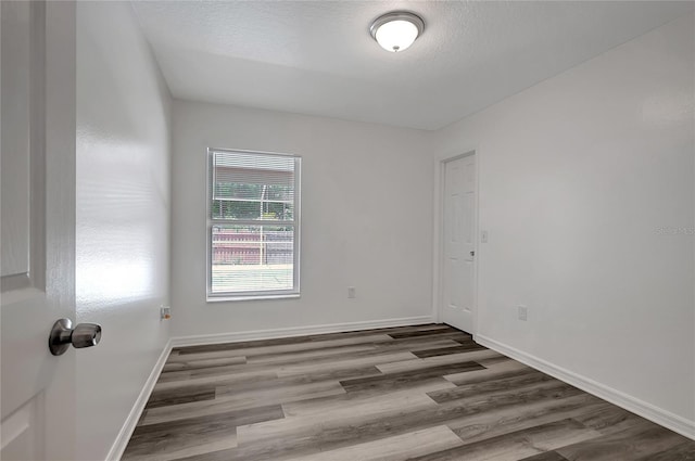 4129 Marlow Loop, Land O Lakes, FL 34639 - unfurnished room featuring wood finished floors and baseboards
