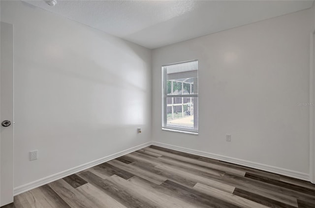 4129 Marlow Loop, Land O Lakes, FL 34639 - unfurnished room featuring wood finished floors and baseboards