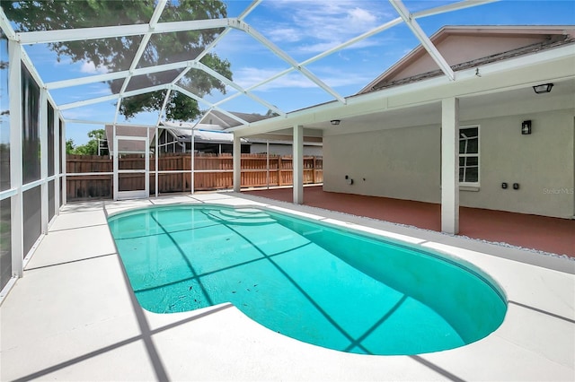 4129 Marlow Loop, Land O Lakes, FL 34639 - view of swimming pool with a patio area and glass enclosure