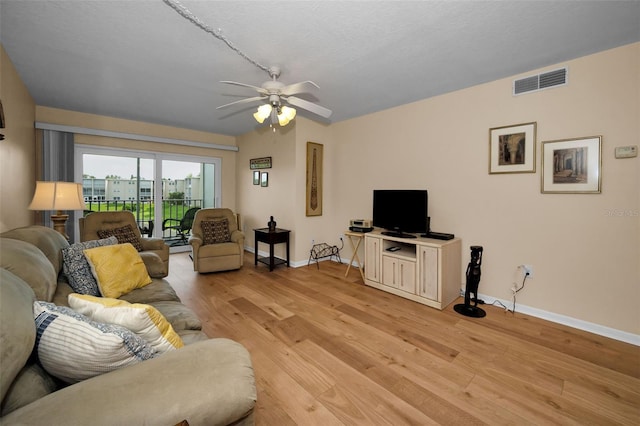 960 Virginia St Unit 204, Dunedin, FL 34698 - living room with light wood-style floors and a ceiling fan