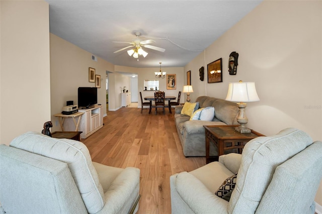 960 Virginia St Unit 204, Dunedin, FL 34698 - living area featuring light wood-type flooring, a ceiling fan, and a chandelier