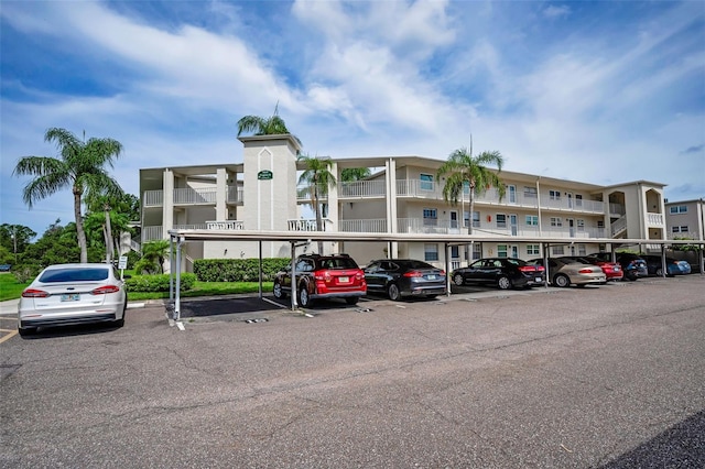 960 Virginia St Unit 204, Dunedin, FL 34698 - view of apartment building / complex with covered and uncovered parking