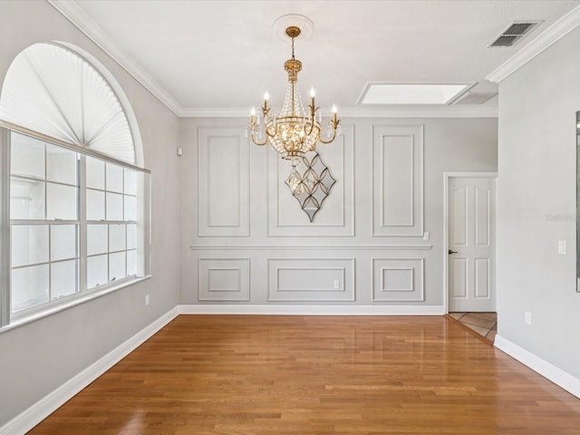 18803 Misty Shores Ln, Lutz, FL 33548 - unfurnished dining area with a chandelier, wood finished floors, and ornamental molding