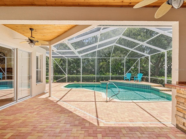 18803 Misty Shores Ln, Lutz, FL 33548 - swimming pool featuring ceiling fan, a patio area, and glass enclosure