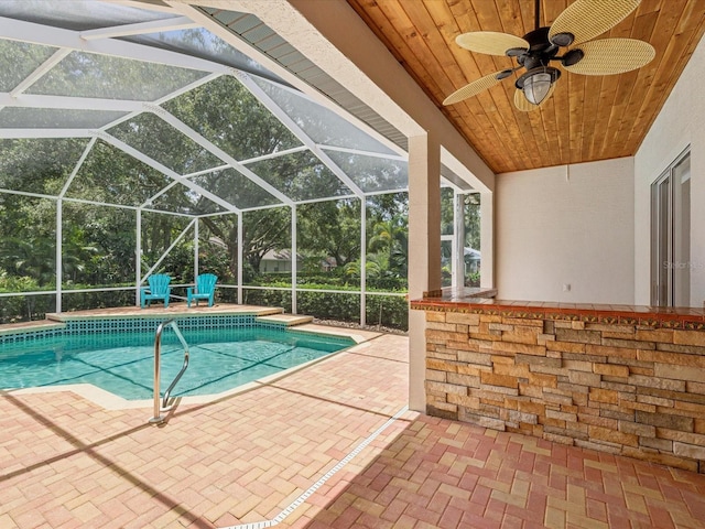 18803 Misty Shores Ln, Lutz, FL 33548 - swimming pool with a patio area, ceiling fan, and a lanai