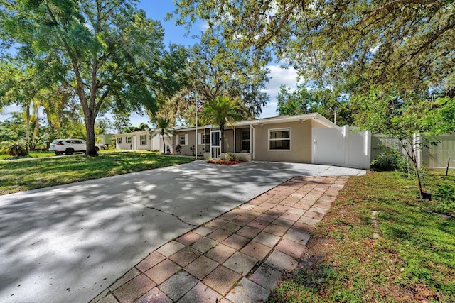 7003 Yule Ln, Tampa, FL 33637 - view of front of home with concrete driveway and stucco siding