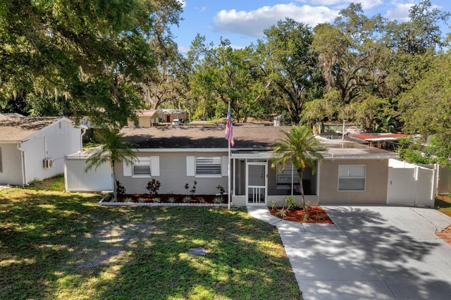 7003 Yule Ln, Tampa, FL 33637 - view of front of house featuring driveway and view of scattered trees