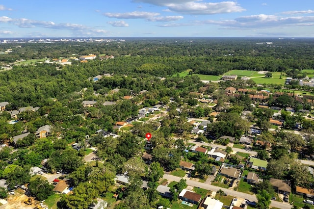 7003 Yule Ln, Tampa, FL 33637 - aerial view of property and surrounding area featuring a forest and nearby suburban area