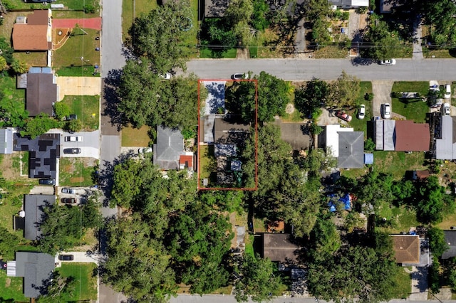 7003 Yule Ln, Tampa, FL 33637 - aerial perspective of suburban area featuring property boundaries highlighted