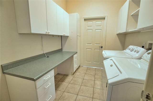 8354 Palmetto Ct, Englewood, FL 34224 - laundry area with cabinet space, light tile patterned floors, and washing machine and dryer