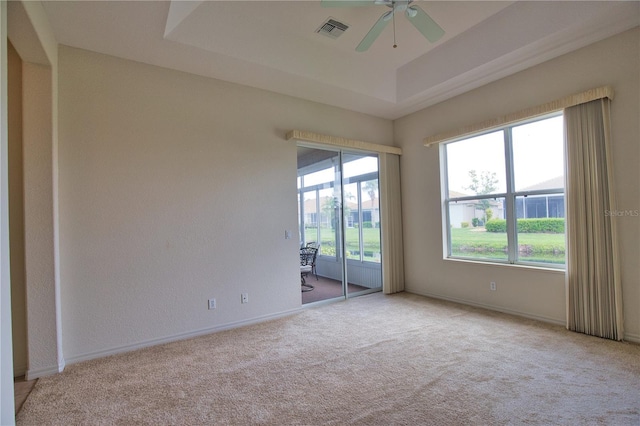 8354 Palmetto Ct, Englewood, FL 34224 - carpeted empty room with ceiling fan and a raised ceiling