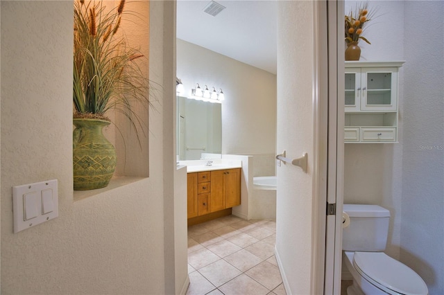 8354 Palmetto Ct, Englewood, FL 34224 - full bathroom with vanity, tile patterned flooring, a bathtub, and a textured wall