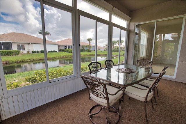 8354 Palmetto Ct, Englewood, FL 34224 - sunroom featuring a water view, carpet flooring, and plenty of natural light