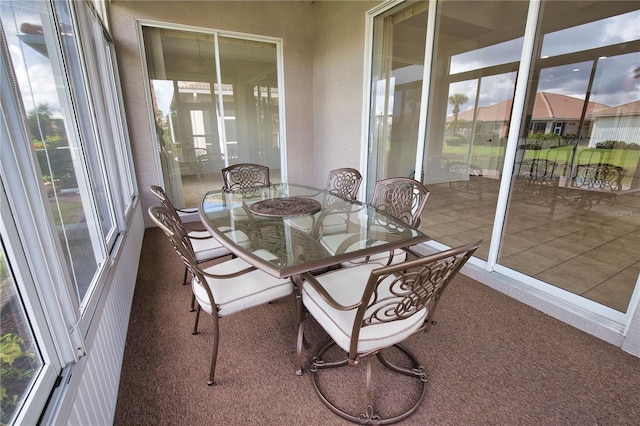 8354 Palmetto Ct, Englewood, FL 34224 - sunroom with carpet flooring
