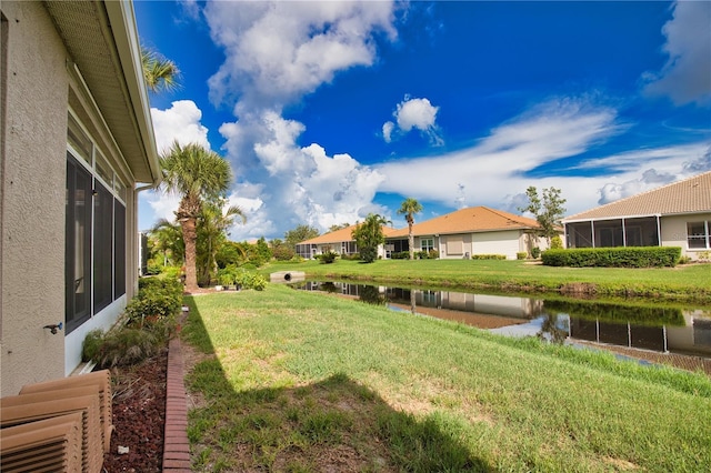 8354 Palmetto Ct, Englewood, FL 34224 - view of grassy yard with a water view and a residential view