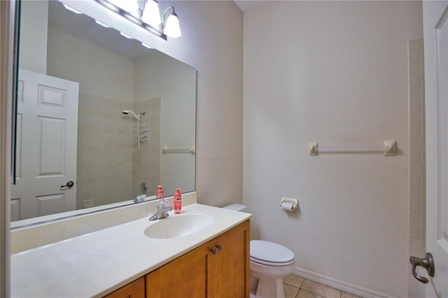 8354 Palmetto Ct, Englewood, FL 34224 - bathroom with vanity, tiled shower, tile patterned floors, and a textured wall