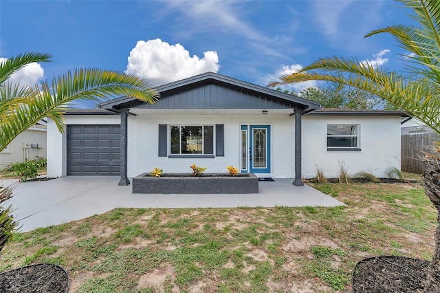 8045 Colton Dr, Port Richey, FL 34668 - ranch-style house featuring an attached garage, driveway, and brick siding