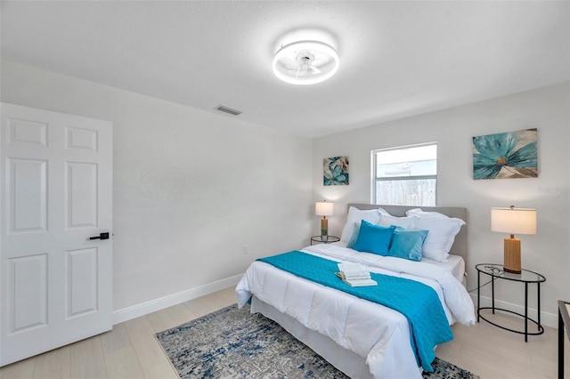 8045 Colton Dr, Port Richey, FL 34668 - bedroom with wood finished floors and baseboards