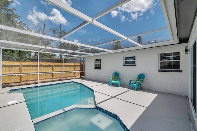 8045 Colton Dr, Port Richey, FL 34668 - view of swimming pool featuring a patio area, a pool with connected hot tub, and glass enclosure