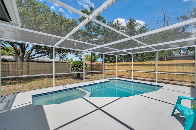 8045 Colton Dr, Port Richey, FL 34668 - view of pool featuring a patio, a fenced backyard, a pool with connected hot tub, and glass enclosure