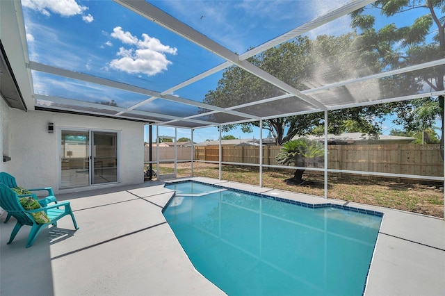 8045 Colton Dr, Port Richey, FL 34668 - view of pool with a fenced backyard, a pool with connected hot tub, a patio, and a lanai
