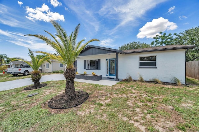 8045 Colton Dr, Port Richey, FL 34668 - ranch-style home featuring stucco siding