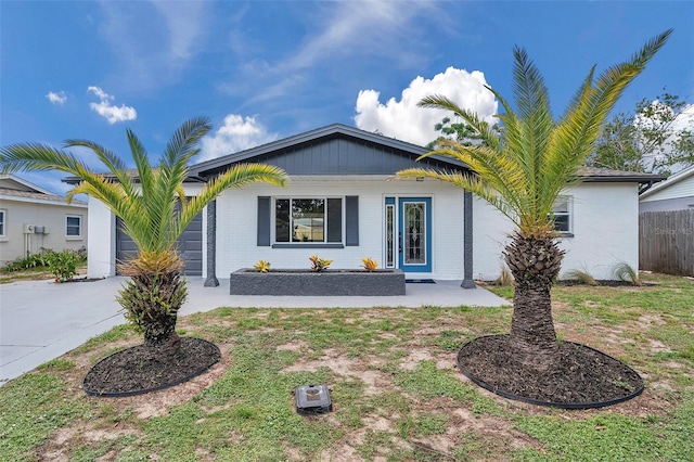 8045 Colton Dr, Port Richey, FL 34668 - ranch-style house with brick siding and a porch