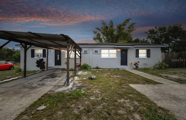 9615 N 13th St, Tampa, FL 33612 - view of front of home with concrete block siding and a carport