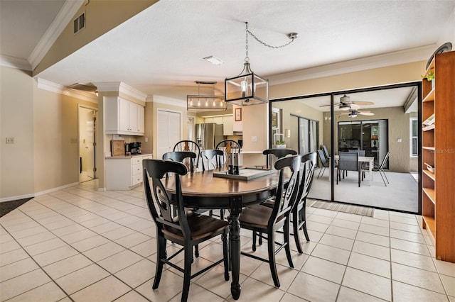 2925 Deerbrook Dr, Lakeland, FL 33811 - dining area with light tile patterned flooring, ceiling fan, and crown molding