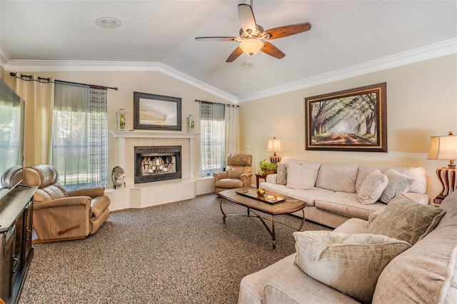 2925 Deerbrook Dr, Lakeland, FL 33811 - living room featuring ceiling fan, a tiled fireplace, carpet, ornamental molding, and vaulted ceiling