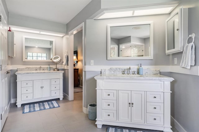 2925 Deerbrook Dr, Lakeland, FL 33811 - bathroom with two vanities and tile patterned floors