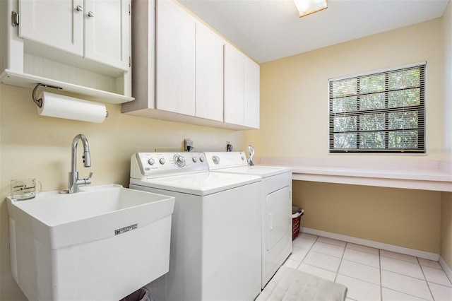 2925 Deerbrook Dr, Lakeland, FL 33811 - laundry area with cabinet space, independent washer and dryer, and light tile patterned floors