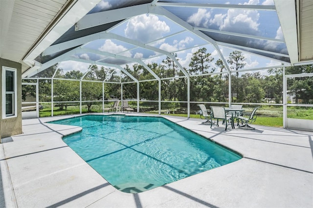 2925 Deerbrook Dr, Lakeland, FL 33811 - swimming pool featuring a patio area, a lanai, and view of wooded area