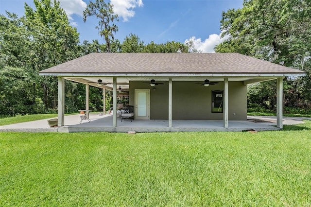2925 Deerbrook Dr, Lakeland, FL 33811 - back of property with a ceiling fan, a yard, a patio area, stucco siding, and a shingled roof