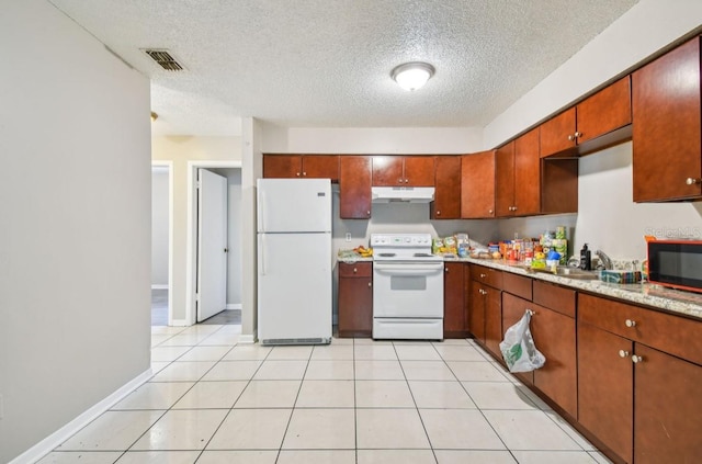 7920 N Marks St, Tampa, FL 33604 - kitchen with white appliances, under cabinet range hood, and a textured ceiling