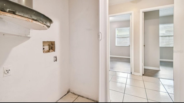 7920 N Marks St, Tampa, FL 33604 - washroom featuring light tile patterned floors and washer hookup