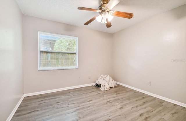 7920 N Marks St, Tampa, FL 33604 - spare room featuring wood finished floors and ceiling fan