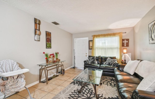 7920 N Marks St, Tampa, FL 33604 - living room with light tile patterned floors and a textured ceiling