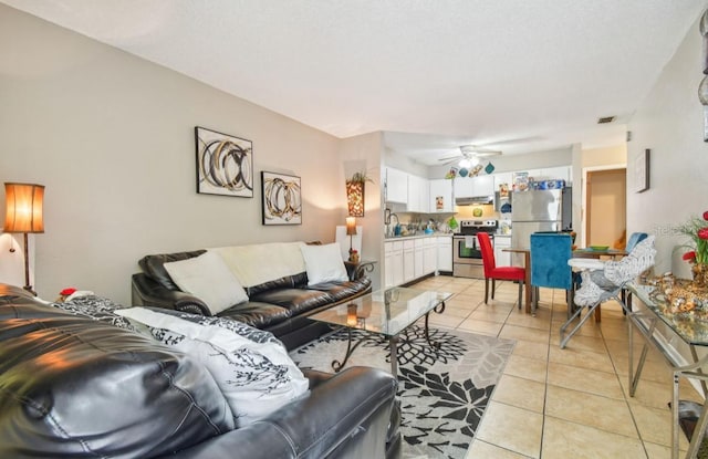 7920 N Marks St, Tampa, FL 33604 - living area with light tile patterned floors and a ceiling fan