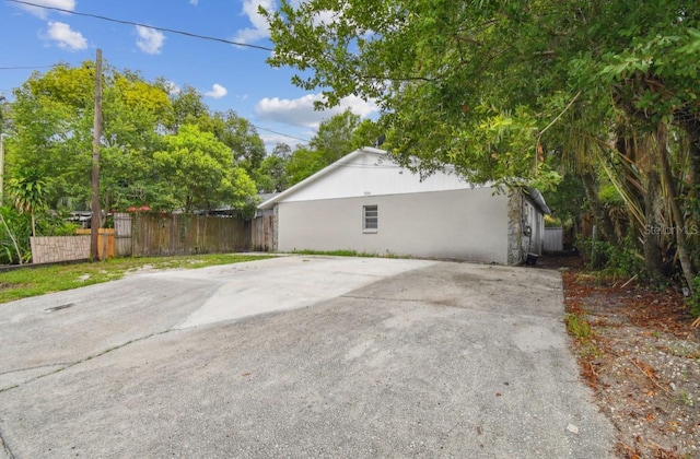 7920 N Marks St, Tampa, FL 33604 - view of property exterior with stucco siding