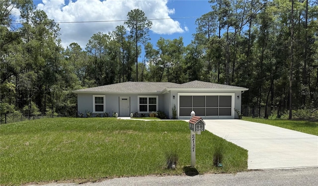 8737 N Spikes Way, Dunnellon, FL 34434 - single story home featuring an attached garage, driveway, and stucco siding