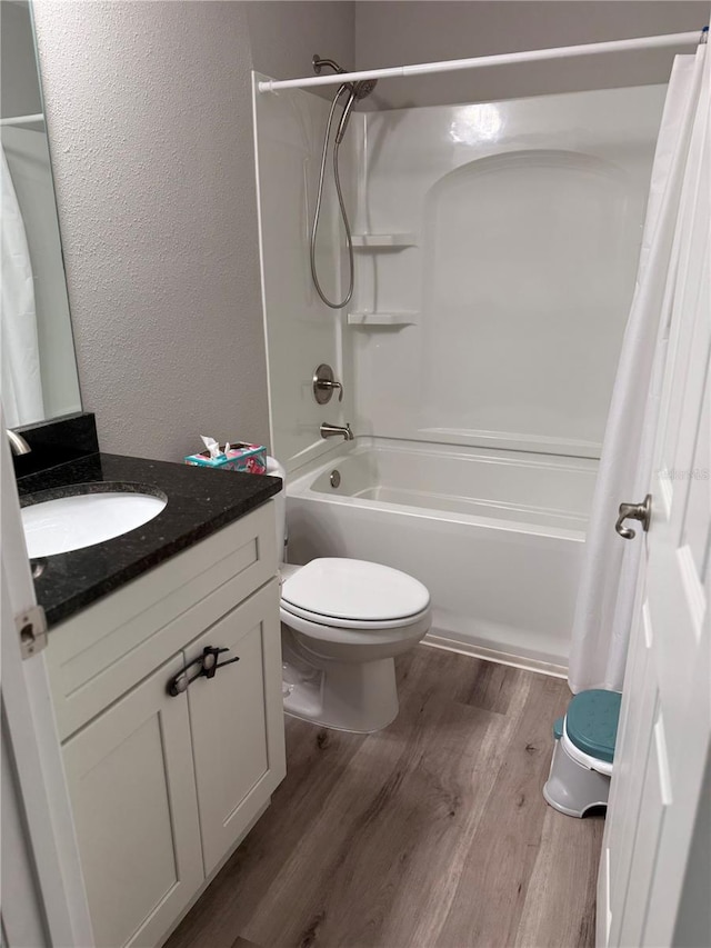 8737 N Spikes Way, Dunnellon, FL 34434 - bathroom with vanity, wood finished floors, shower / bath combo, and a textured wall